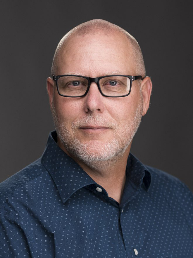 A head shot of John Decker